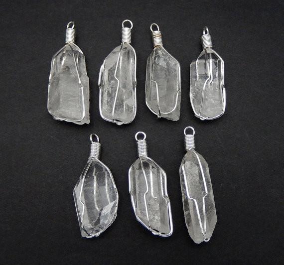 pendants available in crystal quartz with silver wire wrapping 