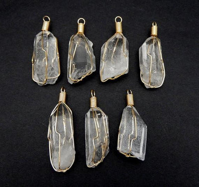 pendants available in crystal quartz wire wrapped in gold 