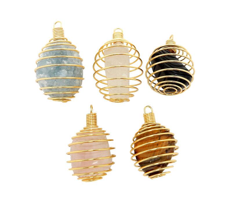 Aerial view of Five Gold Toned Wire Tumbled Stone Cage Pendants, with different stones within them. on a white surface.