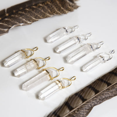 Four Crystal Quartz Pencil Point Pendant with Platinum bail and four Crystal Quartz Pencil Point Pendant with Gold bail  side view