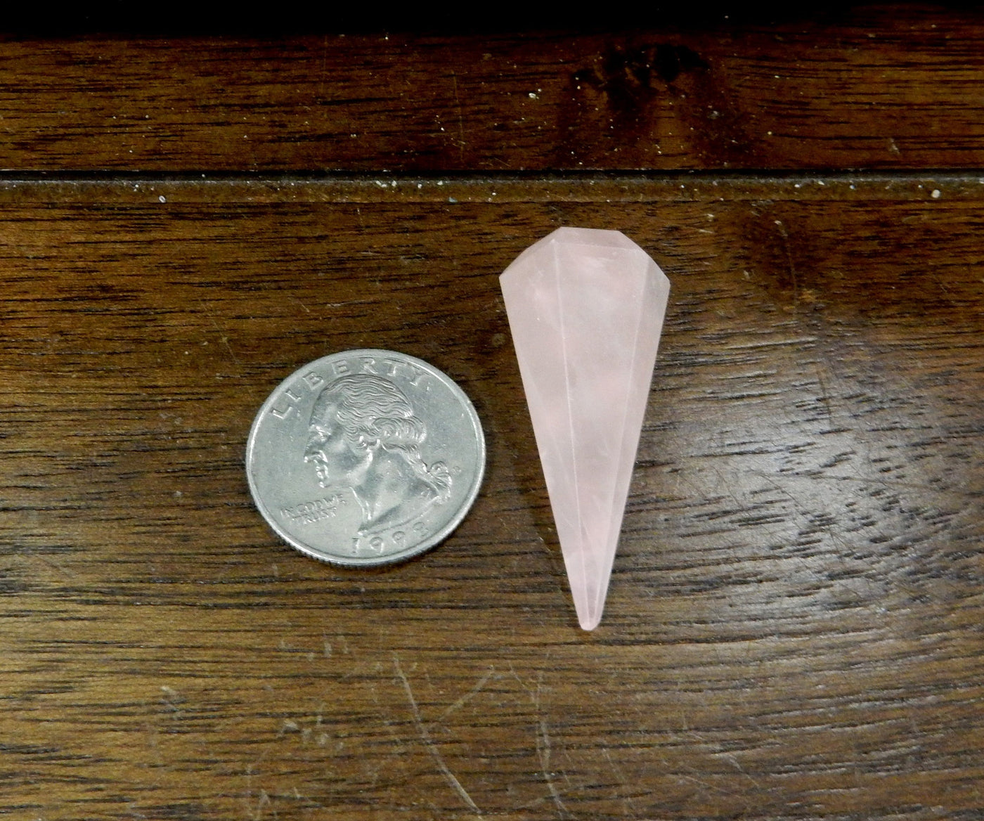 Rose Quartz Pendulum Point Top Side Drilled Bead next to quarter for size comparison 