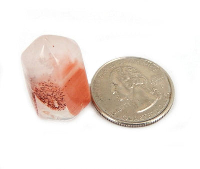 Single Petite Red Hematite Crystal Quartz Point next to quarter for size comparison 