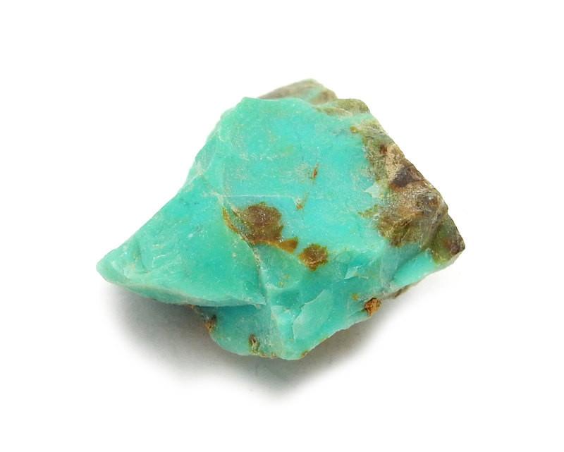 Single Petite Rough Natural Apache Turquoise in a white background close up view