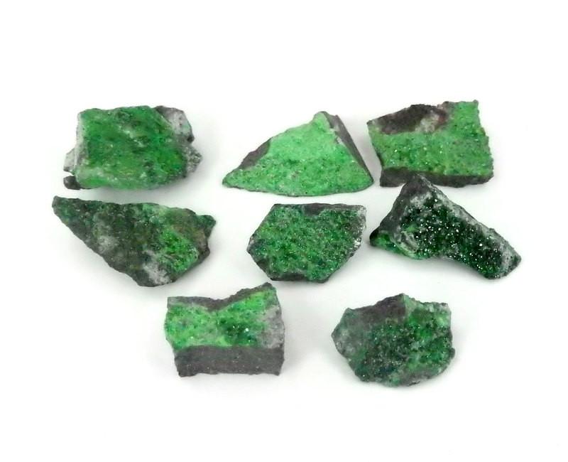 A bundle of Beautiful Rare Stone from Russia Petite Uvarovite Stone on a white background