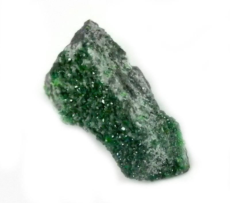 Single Petite Uvarovite Stone close up angle view on a white background