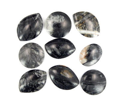 multiple Picasso Marble Stone Marquise  round and oval shaped Cabochons displayed on white background to show various colors patterns shapes sizes