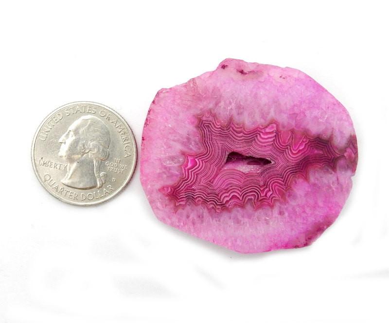 Pink Drilled Agate Slice--Front close view of size reference compared with a quarter. 