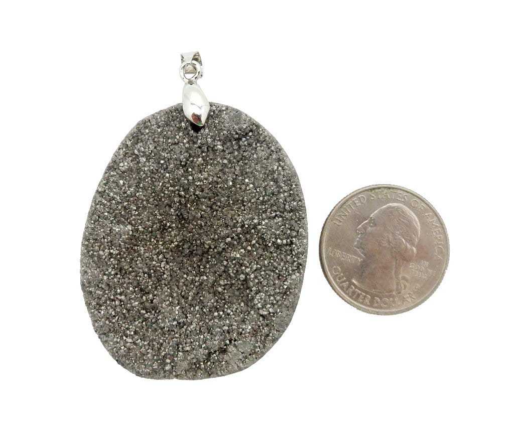 pendant next to a quarter for size reference 