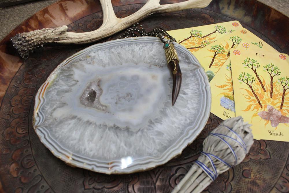 Picture of thick natural agate platter with items around for display.