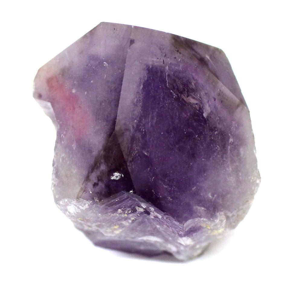 up close shot of amethyst point on white background