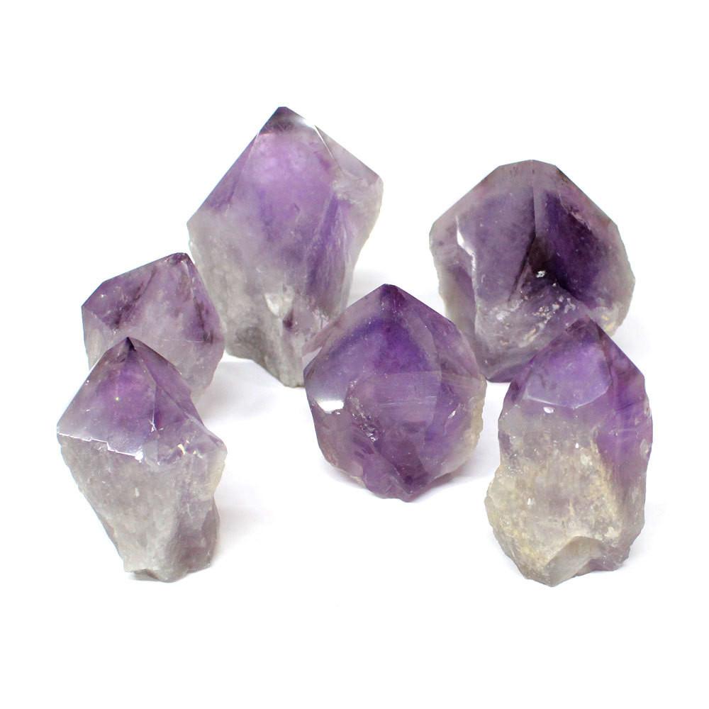 6 amethyst points on white background