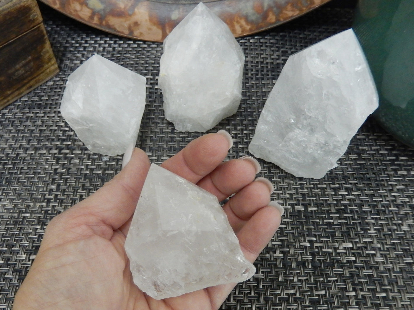 Crystal Quartz Semi Polished Points with size 100-200g  in a hand for size reference