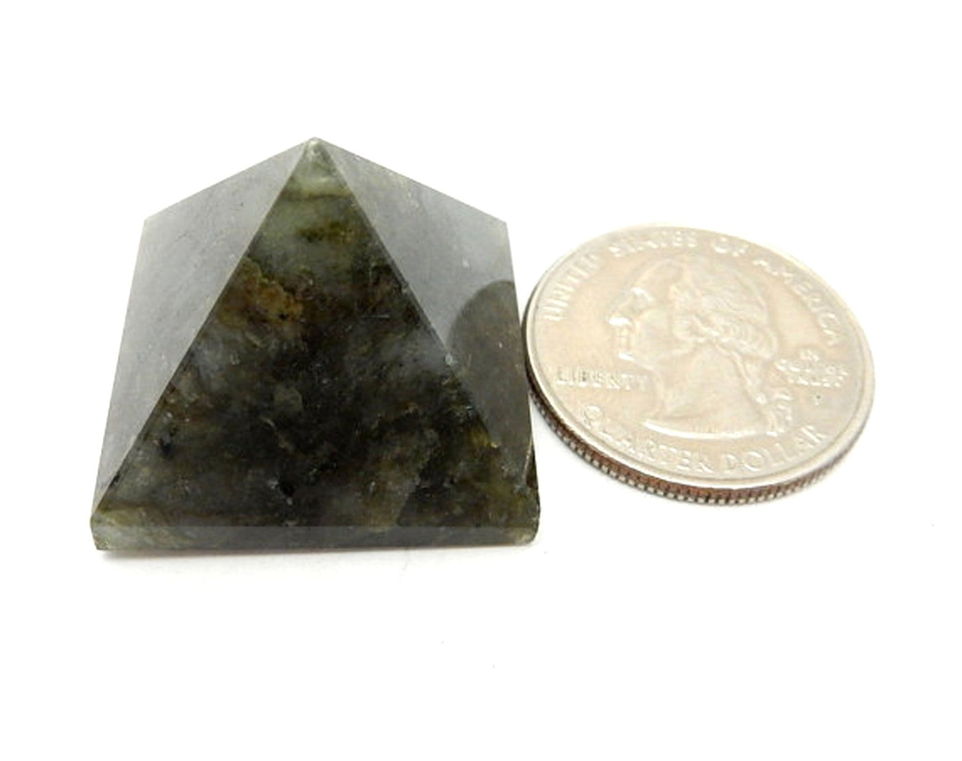 Labradorite Pyramid next to quarter for size comparison