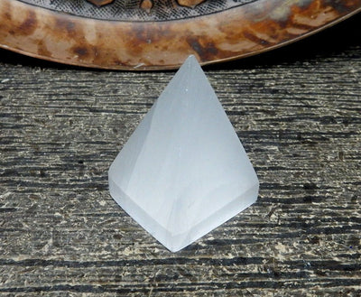 close up of one selenite pyramid for details