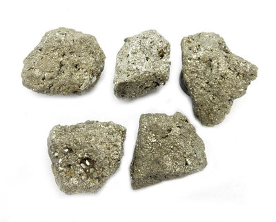 Pyrite Nuggets With Magnet - 5 on a table