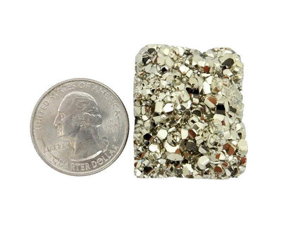 view of 1 Pyrite Square Cabochon next to a quarter for sizing