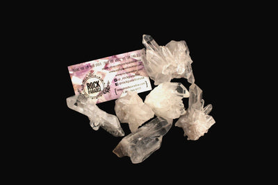 6 Raw Crystal Clusters with Rock Paradise business card on black background