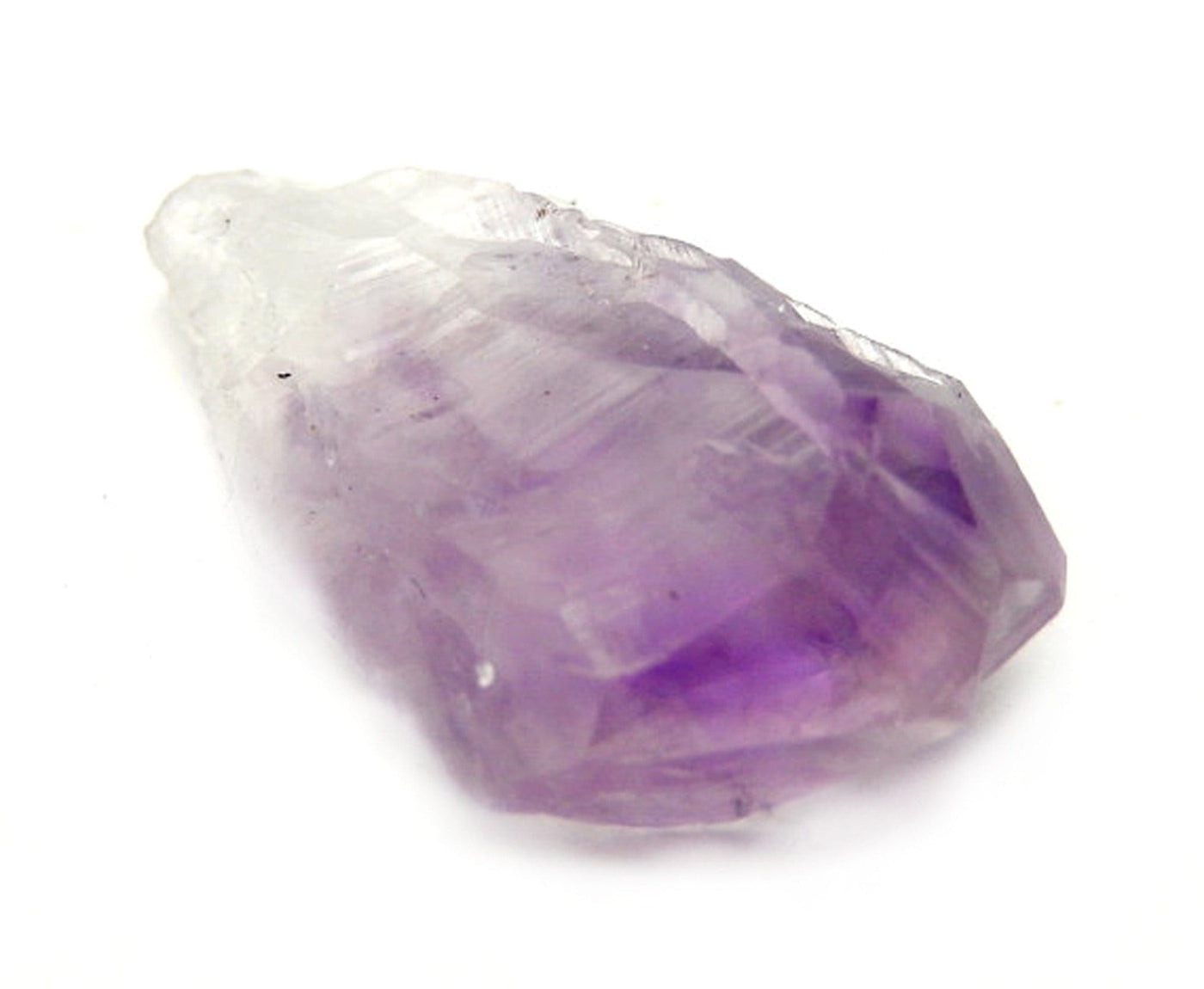 Up close angled shot of Raw Amethyst Point on white background