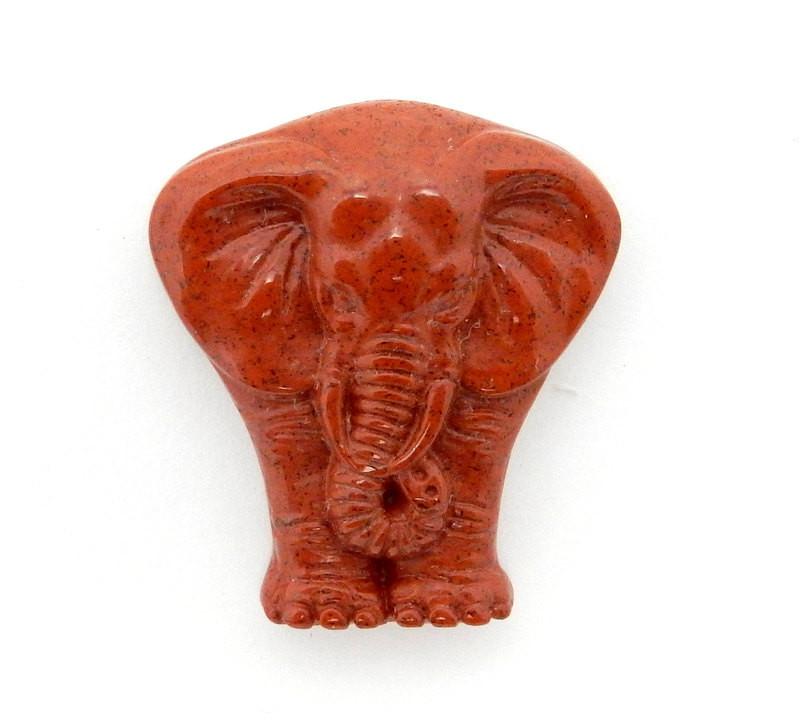 Up close shot of Red Jasper Elephant Cabochon on white background