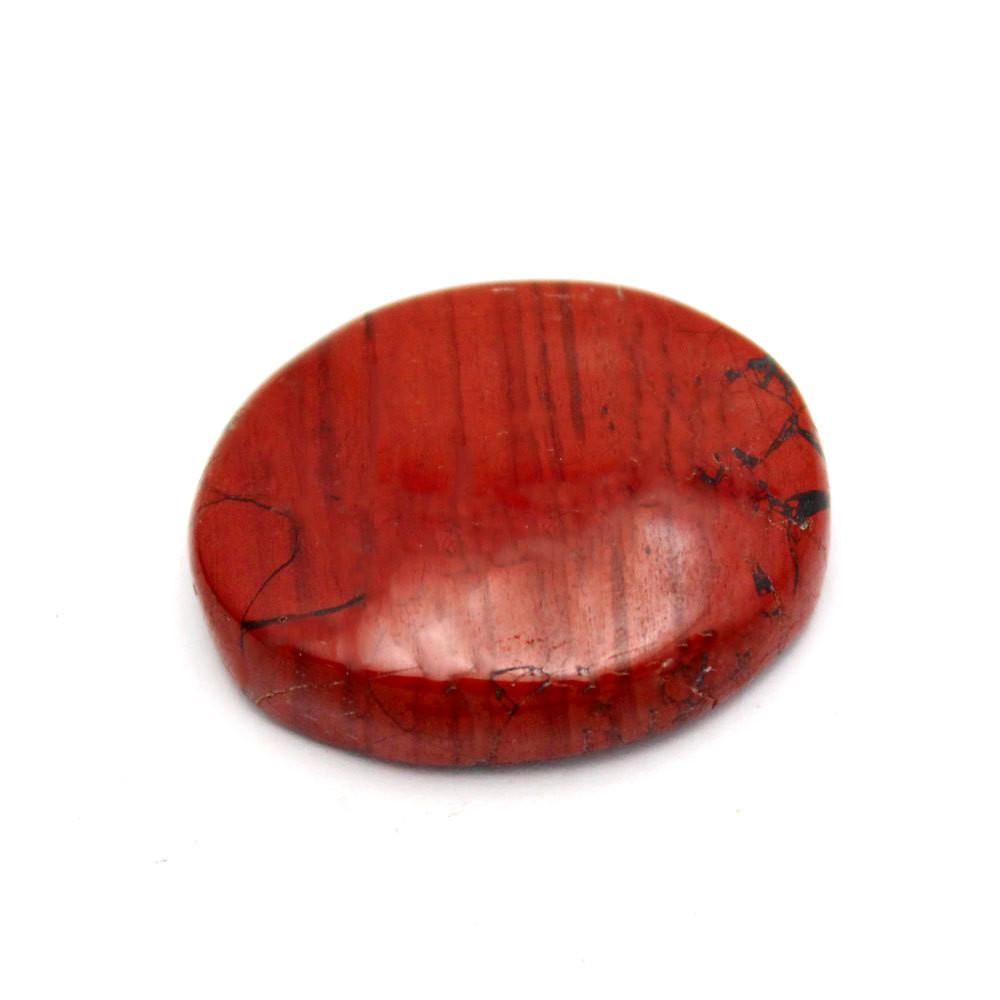 Up close shot of Red Jasper Worry Stone Slab on white background