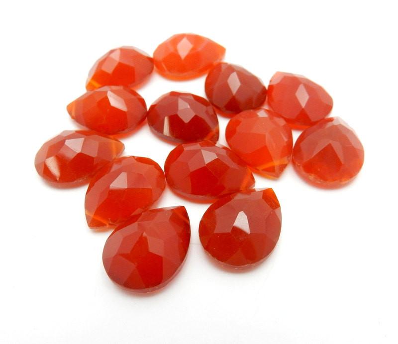 Angled shot of Red Onyx  Briolette beads on white background