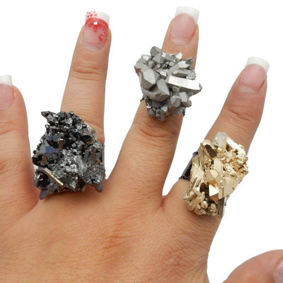 3 crystal rings on a hand