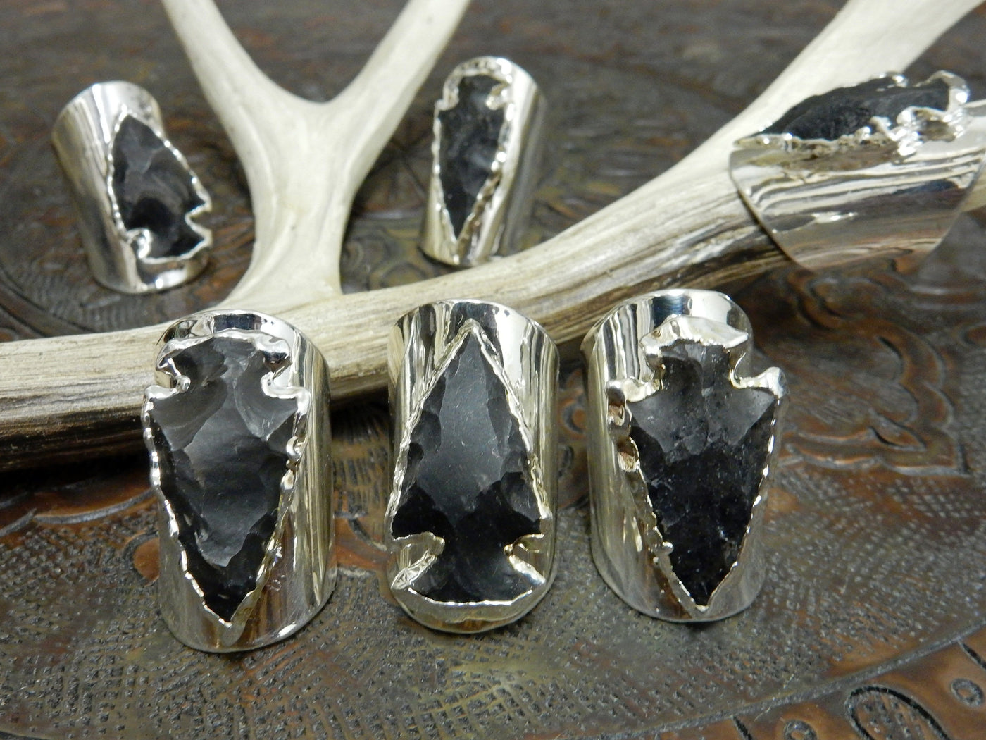 6 Black Obsidian Silver edged Arrowhead set on Adjustable Silver Electroplated Cigar Band Rings with decorations
