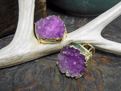 front and side view of pink druzy rings in gold