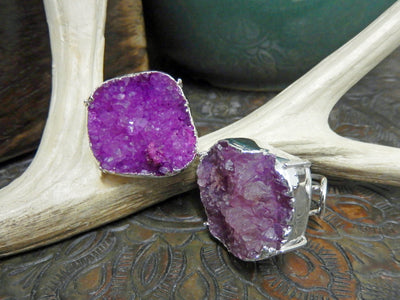 front and side view of pink druzy rings in silver