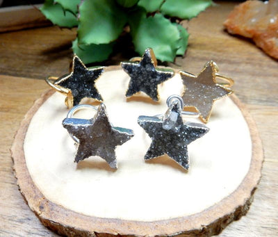 druzy star wrap ring with decorations in the background