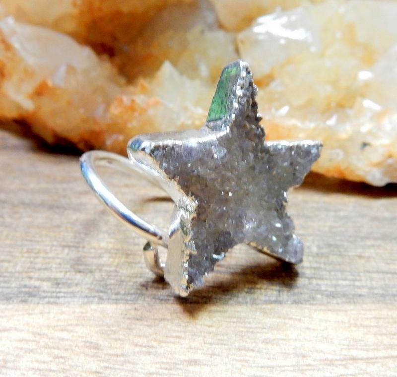 druzy star wrap ring with decorations in the background