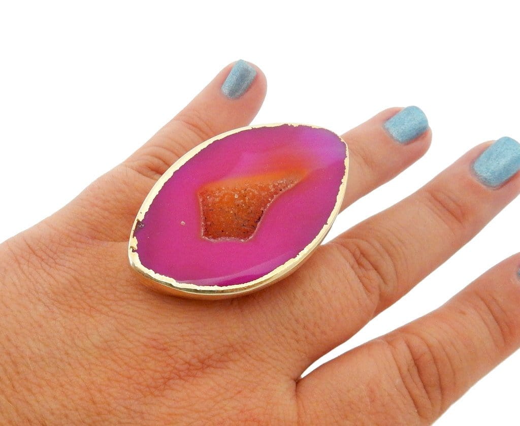 Picture of agate ring electroplated 24k gold in hand. 
