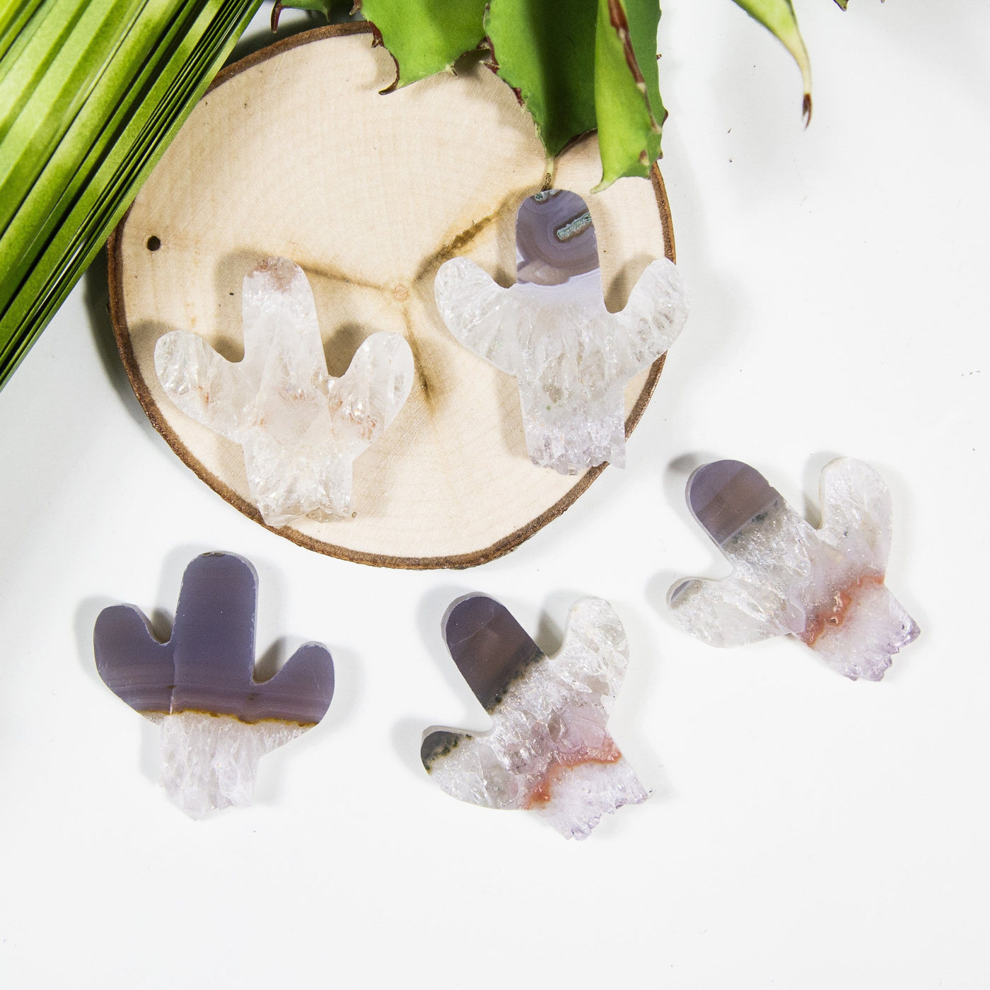 amethyst cactus cabochons with decorations in the background 