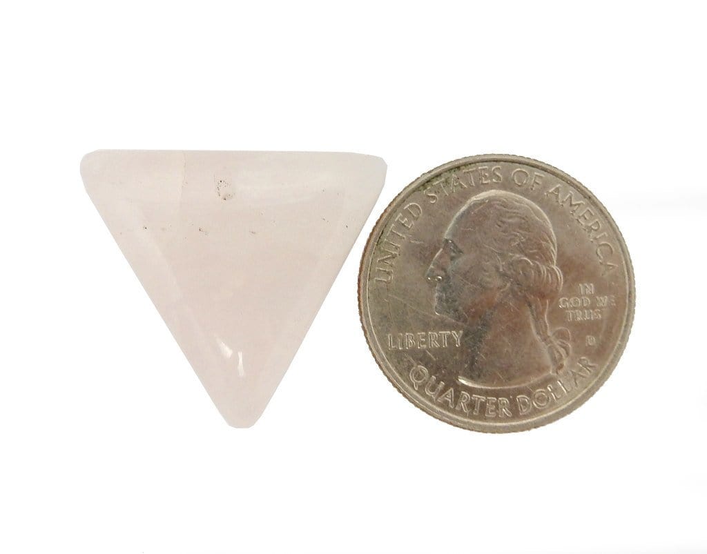 Rose Quartz Drilled Bead next to a quarter for size reference on white background