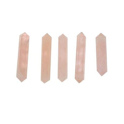 5 Rose Quartz Double Double Terminated Pencil Points lined up on white background