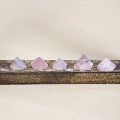rose quartz Pyramid displayed to show size variations