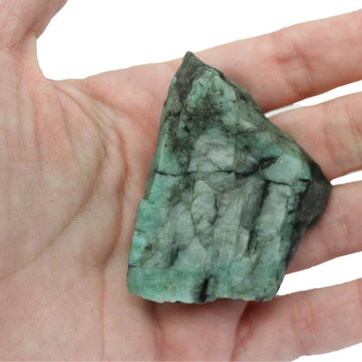 Hand holding Rough Emerald Nugget