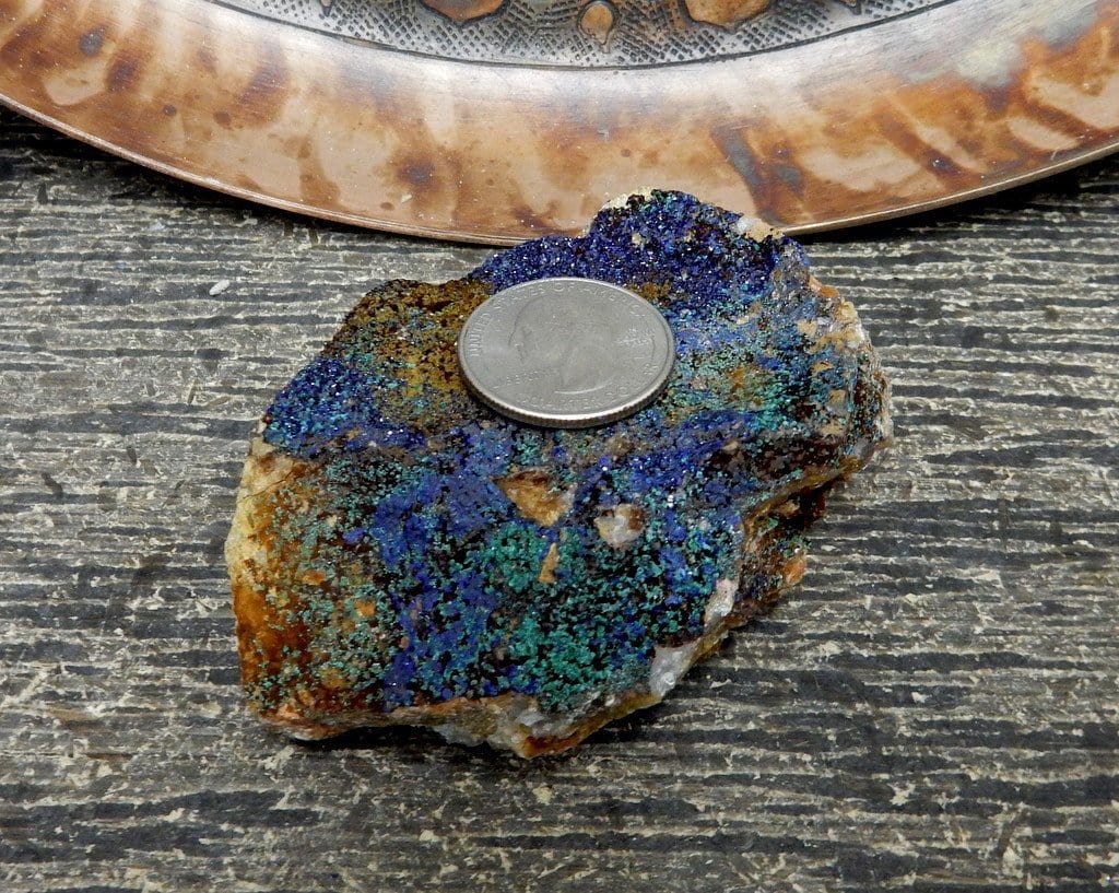 azurite stone with quarter on top of it for size reference