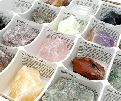 Up close shot of box of Rough Stones with meanings of each stone