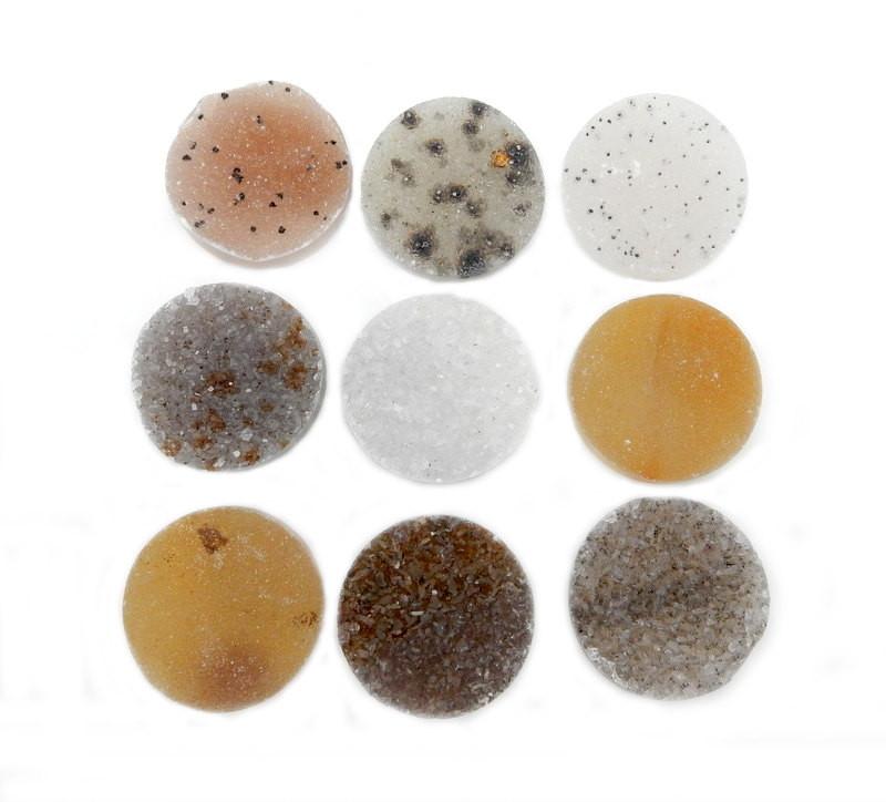 multiple round druzy cabochons displayed to show the differences in the color shades 