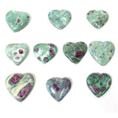Ten Ruby Fuchsite Heart Shaped Stones displayed on a white surface.