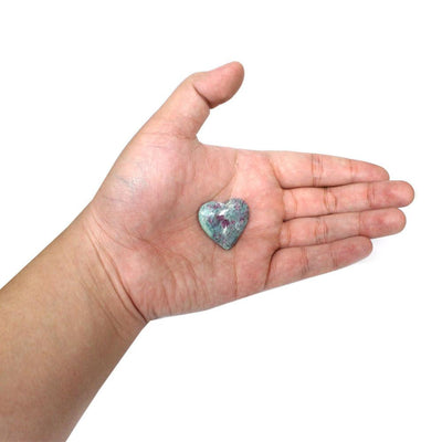 One Ruby Fuchsite Heart in palm of a hand.