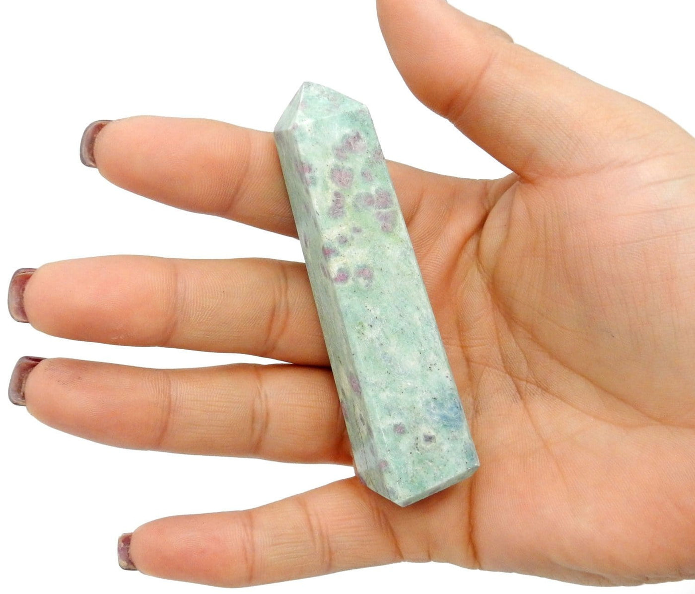 Ruby Fuchsite Tower in a hand for size reference