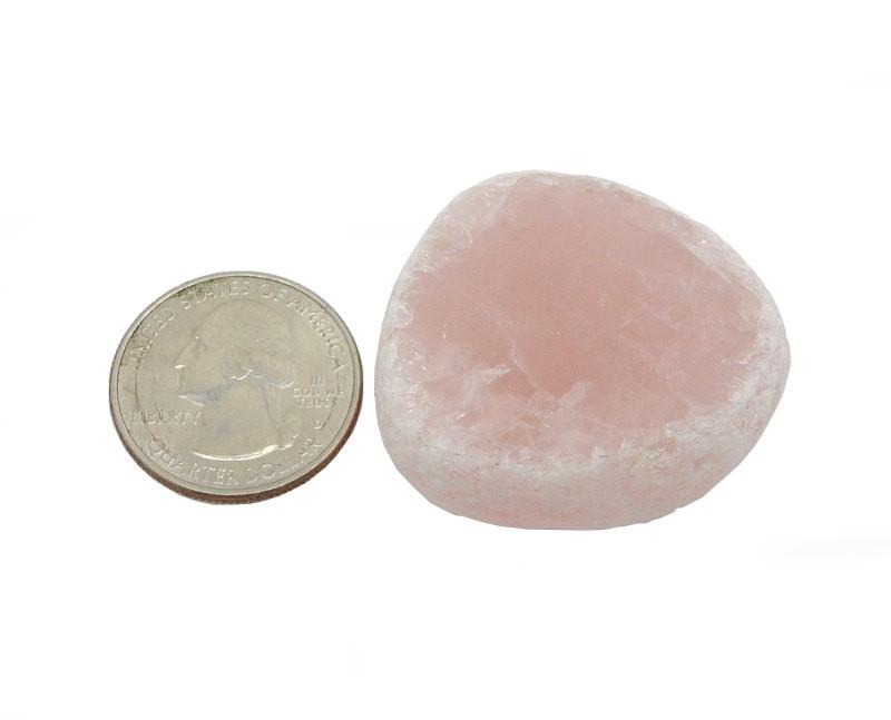 tumbled rose quartz seer stone with quarter for size reference
