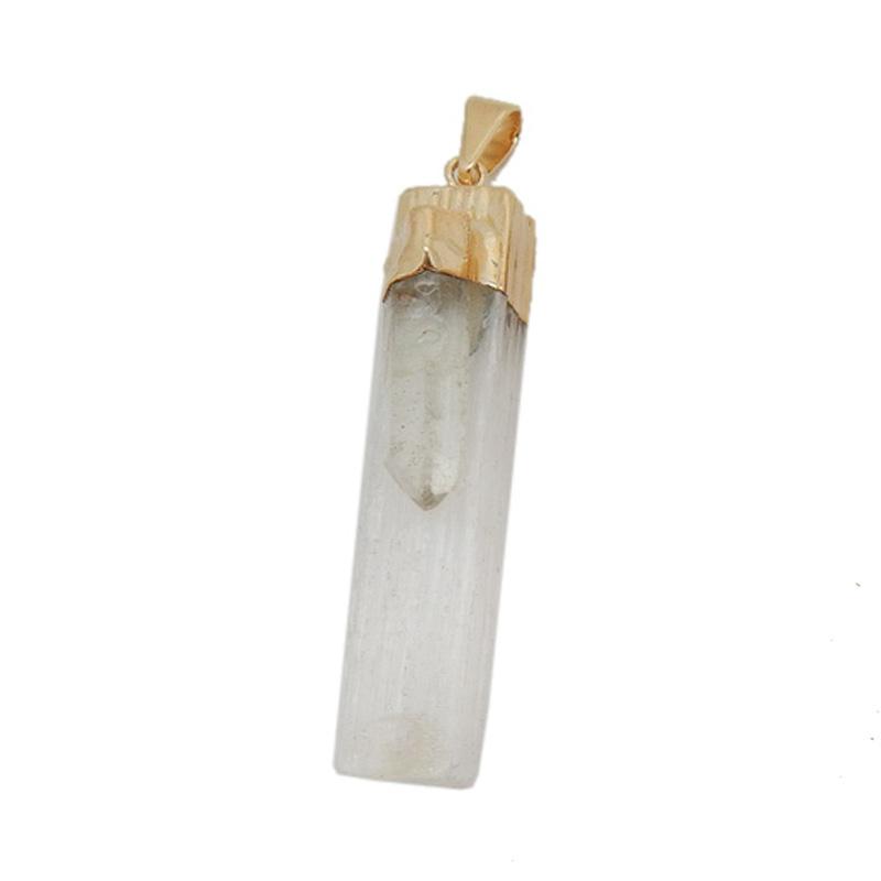 close up of selenite with crystal quartz gold pendant for details
