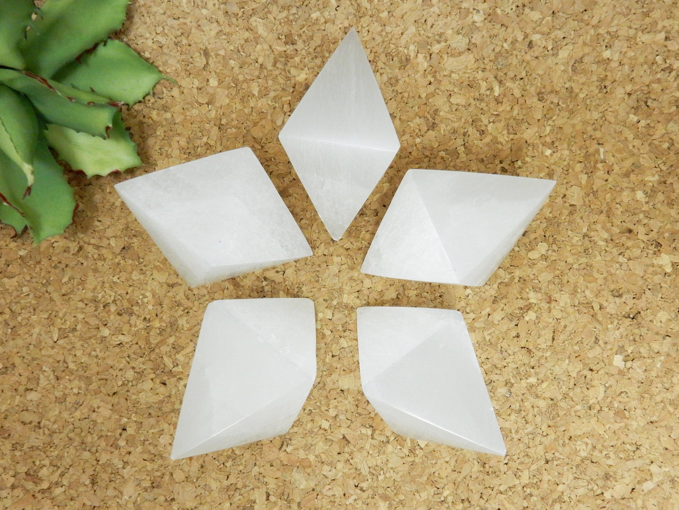 many selenite double pyramids on display for possible variations