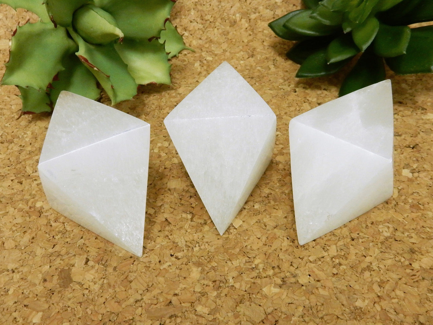 close up of selenite double pyramids on display for details and possible variations