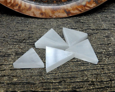 close up of selenite triangles on display for possible variations