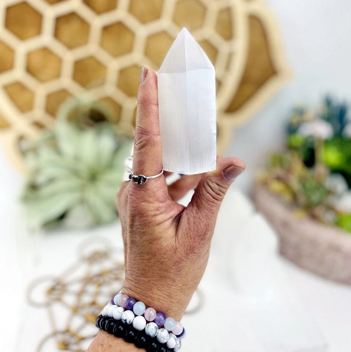 Selenite Tower Points 10CM tall in a hand for size