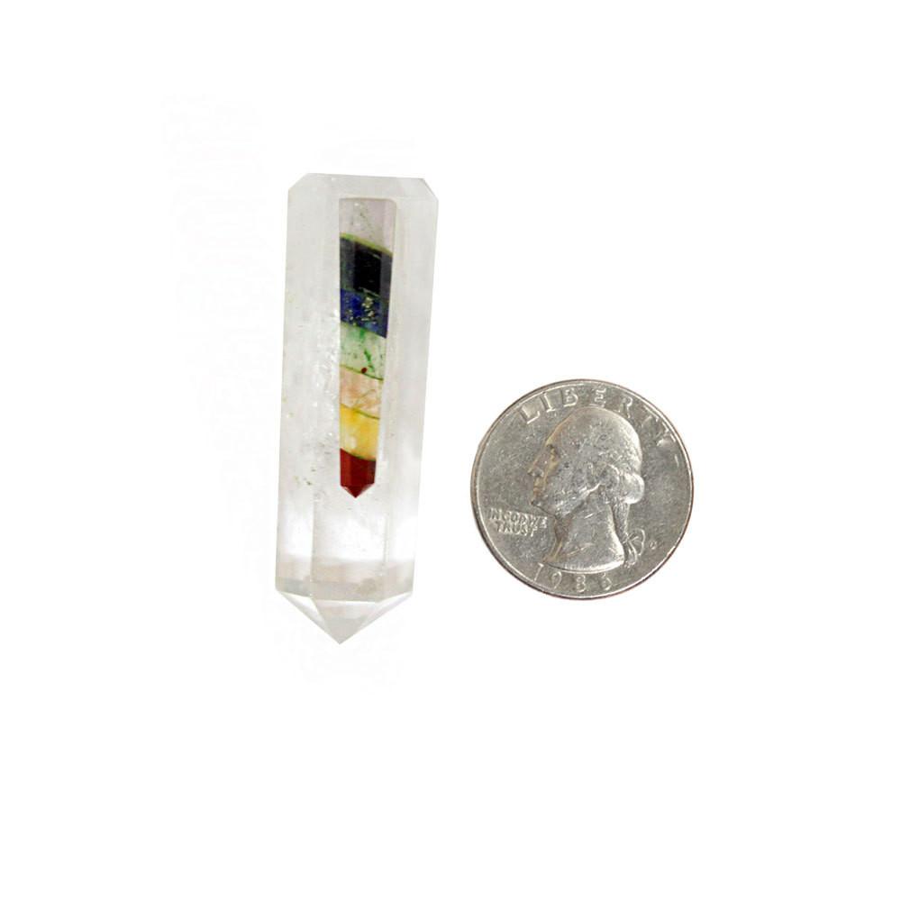 seven chakra crystal quartz point with quarter for size reference